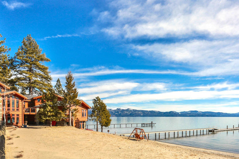 view of lake tahoe, beach and Tonopolo with blue sky and clouds